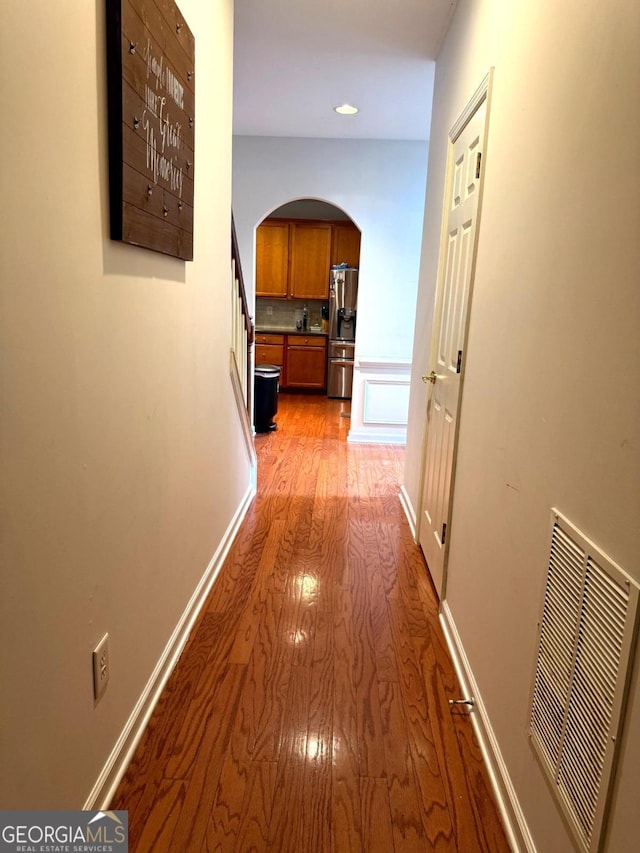 3439 Tupelo Trl, Auburn, GA 30011 - corridor with arched walkways, light wood finished floors, and recessed lighting