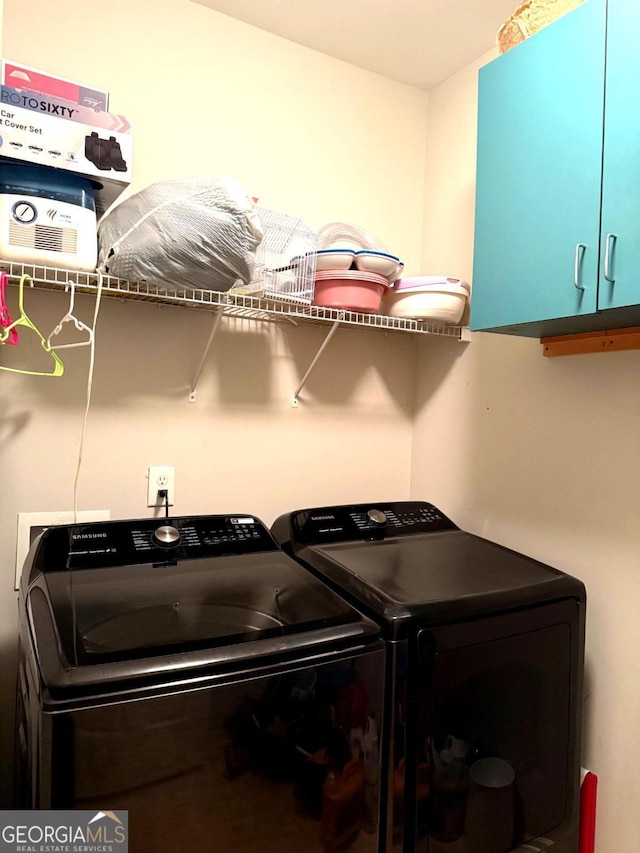 3439 Tupelo Trl, Auburn, GA 30011 - washroom with cabinet space and washer and dryer