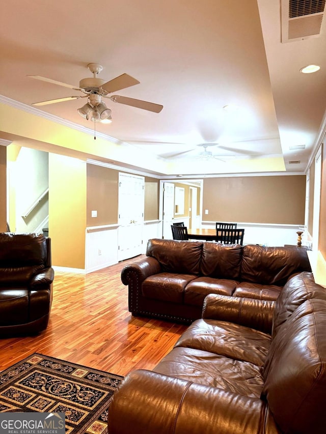 3439 Tupelo Trl, Auburn, GA 30011 - living room featuring ceiling fan, ornamental molding, and wood finished floors