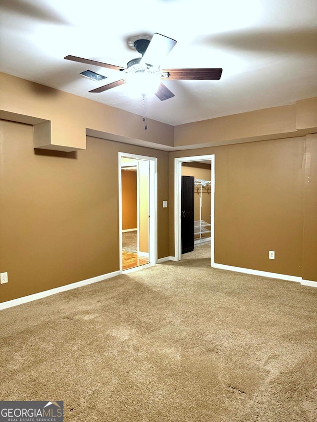 3439 Tupelo Trl, Auburn, GA 30011 - carpeted empty room with ceiling fan and baseboards