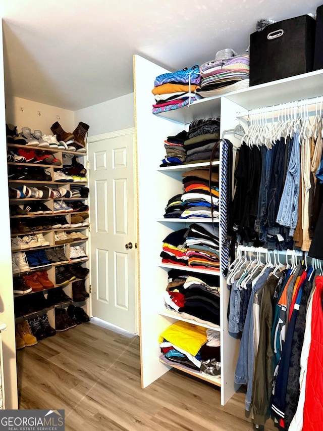 3439 Tupelo Trl, Auburn, GA 30011 - spacious closet with wood finished floors