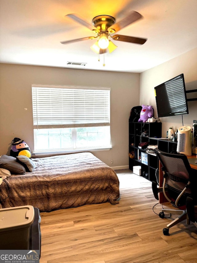 3439 Tupelo Trl, Auburn, GA 30011 - bedroom featuring light wood finished floors, an office area, and a ceiling fan