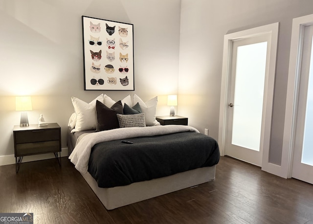 560 Dutch Valley Rd NE Unit 2412, Atlanta, GA 30324 - bedroom with dark wood-style flooring and baseboards