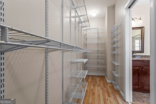 1605 Spinnaker Dr, Alpharetta, GA 30005 - spacious closet featuring light wood-style flooring and a sink