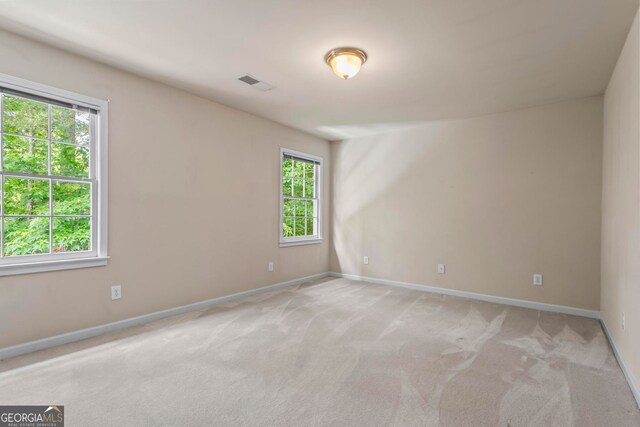 1605 Spinnaker Dr, Alpharetta, GA 30005 - spare room featuring light carpet and baseboards