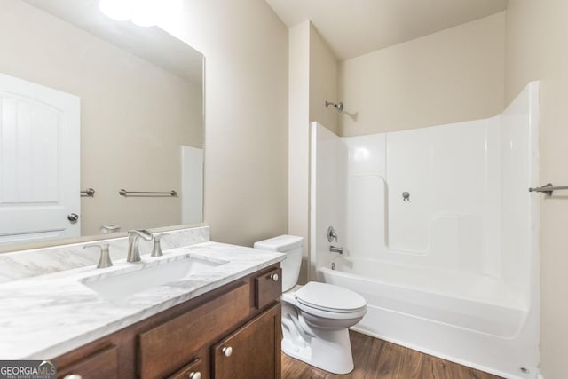 208 Flowing Meadows Dr, Kathleen, GA 31047 - full bathroom featuring vanity, wood finished floors, and shower / bathtub combination
