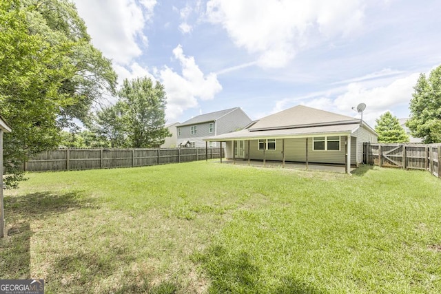 208 Flowing Meadows Dr, Kathleen, GA 31047 - fenced backyard with a patio