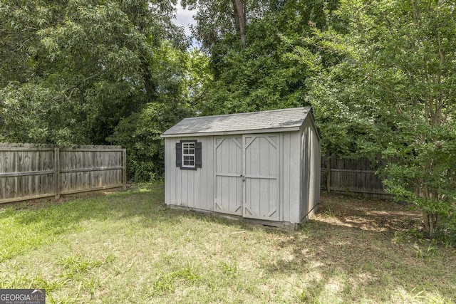 208 Flowing Meadows Dr, Kathleen, GA 31047 - view of shed with a fenced backyard