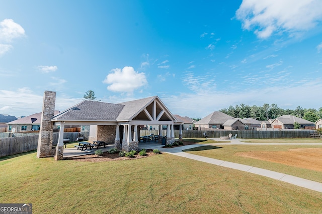 208 Flowing Meadows Dr, Kathleen, GA 31047 - view of front of property with a patio, a fenced backyard, a residential view, and a chimney