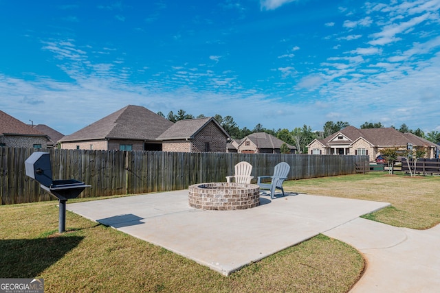 208 Flowing Meadows Dr, Kathleen, GA 31047 - fenced backyard featuring a patio, an outdoor fire pit, and a residential view