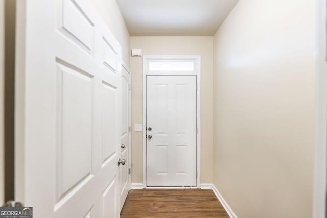 208 Flowing Meadows Dr, Kathleen, GA 31047 - doorway to outside featuring dark wood-style floors and baseboards