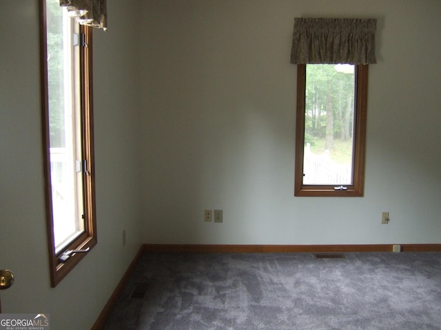 1455 River Cove Rd, Social Circle, GA 30025 - unfurnished room featuring healthy amount of natural light and dark carpet