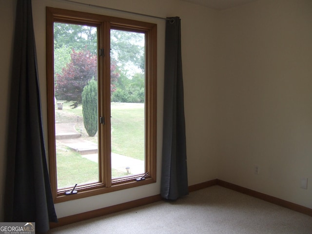 1455 River Cove Rd, Social Circle, GA 30025 - spare room with light carpet and baseboards