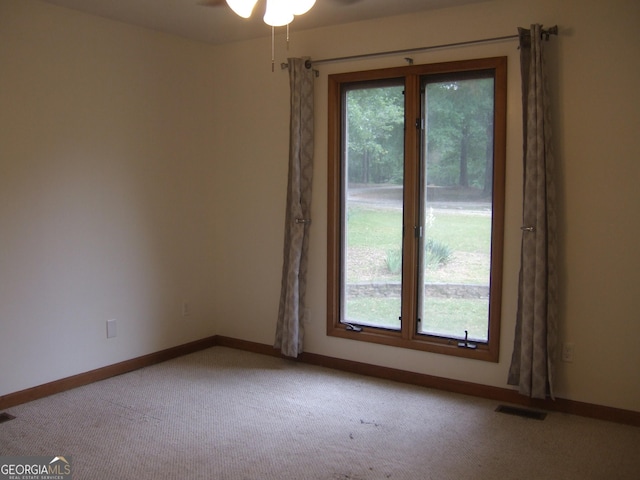 1455 River Cove Rd, Social Circle, GA 30025 - spare room featuring healthy amount of natural light, carpet flooring, and ceiling fan