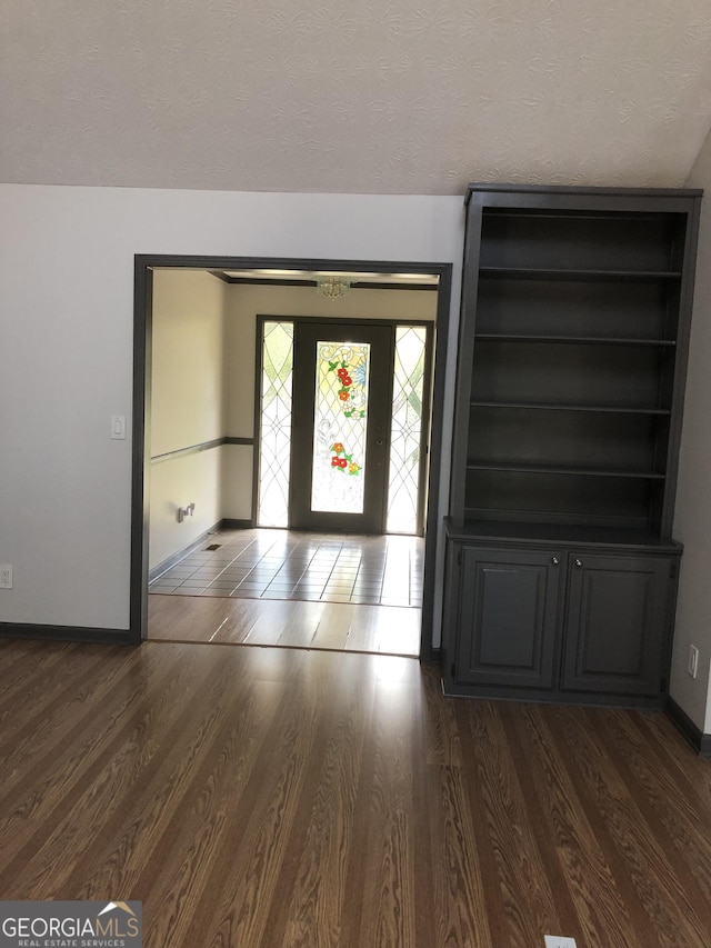 1455 River Cove Rd, Social Circle, GA 30025 - entryway with dark wood-style floors and a textured ceiling