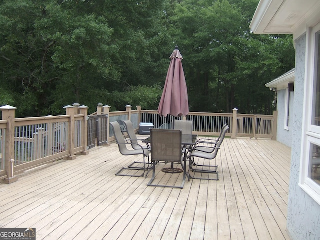 1455 River Cove Rd, Social Circle, GA 30025 - wooden terrace with outdoor dining area