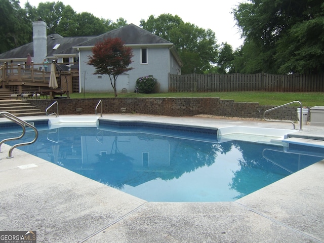 1455 River Cove Rd, Social Circle, GA 30025 - view of pool featuring stairway, a fenced backyard, and a wooden deck