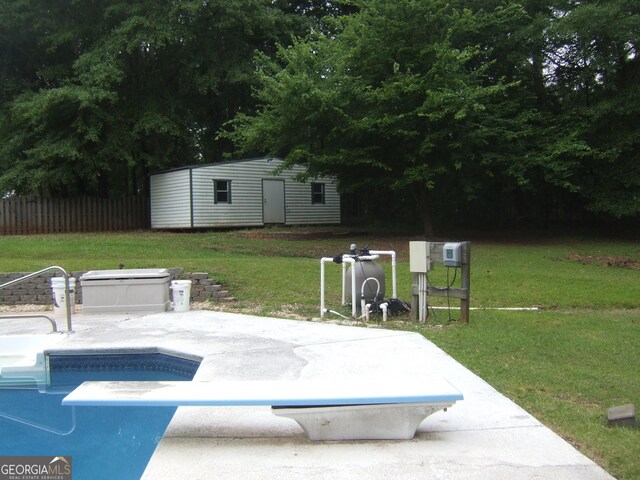 1455 River Cove Rd, Social Circle, GA 30025 - swimming pool featuring an outbuilding, a diving board, and a patio area