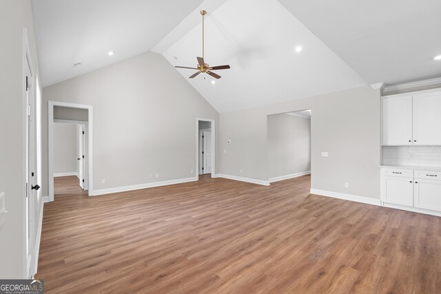 9 Honeysuckle Dr, Claxton, GA 30417 - unfurnished living room featuring a ceiling fan, light wood-type flooring, high vaulted ceiling, and recessed lighting