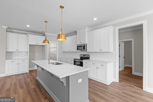 9 Honeysuckle Dr, Claxton, GA 30417 - kitchen with stainless steel appliances, backsplash, light countertops, white cabinets, and recessed lighting