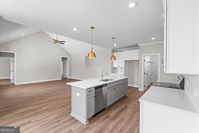 9 Honeysuckle Dr, Claxton, GA 30417 - kitchen featuring stainless steel dishwasher, stove, a ceiling fan, white cabinetry, and light countertops