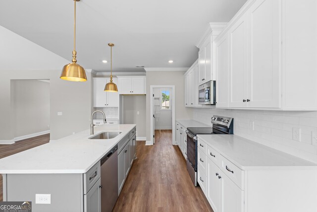 9 Honeysuckle Dr, Claxton, GA 30417 - kitchen with appliances with stainless steel finishes, dark wood-type flooring, backsplash, white cabinetry, and recessed lighting