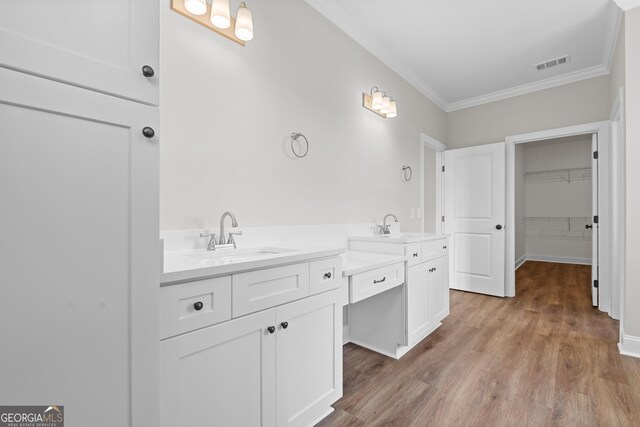 9 Honeysuckle Dr, Claxton, GA 30417 - full bathroom featuring ornamental molding, vanity, wood finished floors, and a spacious closet