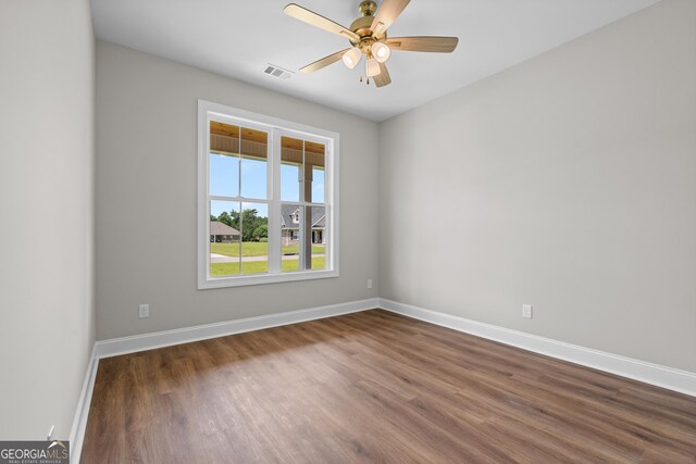 9 Honeysuckle Dr, Claxton, GA 30417 - spare room featuring dark wood-type flooring and ceiling fan