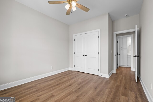 9 Honeysuckle Dr, Claxton, GA 30417 - unfurnished bedroom featuring wood finished floors, a closet, and ceiling fan
