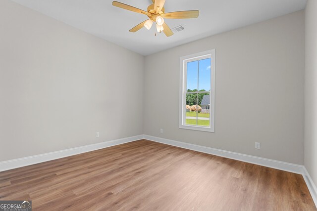 9 Honeysuckle Dr, Claxton, GA 30417 - unfurnished room featuring light wood finished floors and ceiling fan