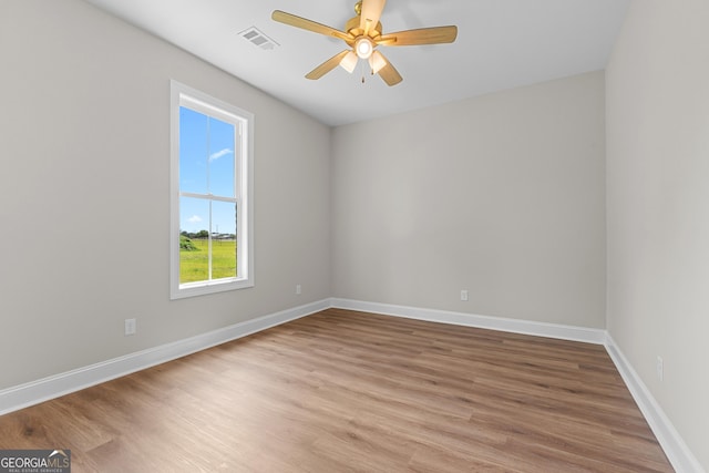 9 Honeysuckle Dr, Claxton, GA 30417 - spare room with light wood finished floors and ceiling fan