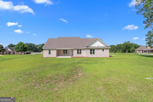 9 Honeysuckle Dr, Claxton, GA 30417 - rear view of house with a patio area and a lawn