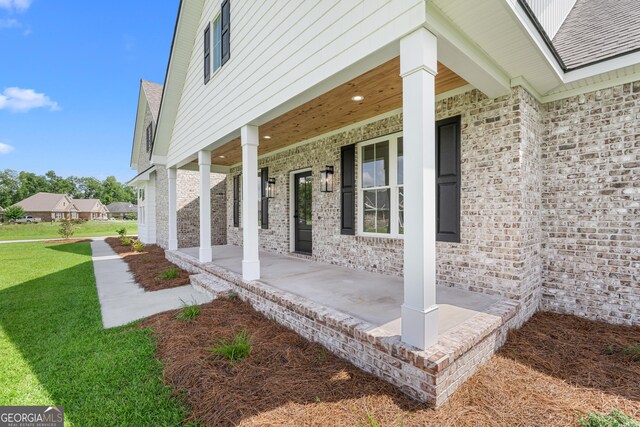 9 Honeysuckle Dr, Claxton, GA 30417 - covered porch with a yard