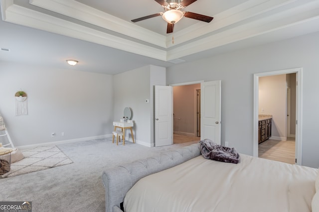 396 Brant Cir, Jefferson, GA 30549 - bedroom featuring light carpet, connected bathroom, and a raised ceiling