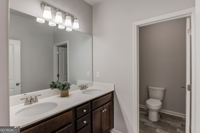 396 Brant Cir, Jefferson, GA 30549 - bathroom featuring wood finished floors and double vanity