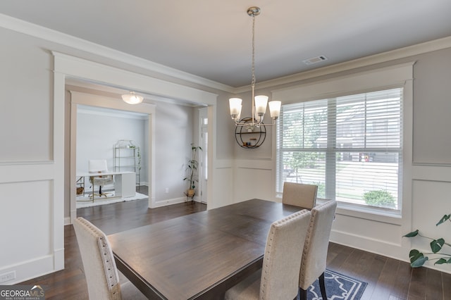 396 Brant Cir, Jefferson, GA 30549 - dining space featuring a chandelier, dark wood-style floors, a decorative wall, ornamental molding, and wainscoting