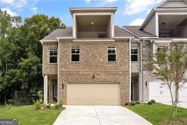 5715 Rocky Falls Dr, Suwanee, GA 30024 - view of front of property with a balcony, a garage, concrete driveway, and brick siding