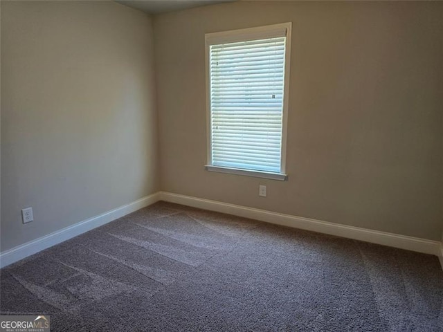 5715 Rocky Falls Dr, Suwanee, GA 30024 - empty room with carpet and healthy amount of natural light