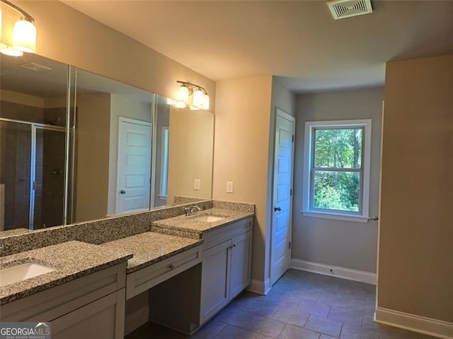 5715 Rocky Falls Dr, Suwanee, GA 30024 - full bathroom with double vanity, a stall shower, and tile patterned floors