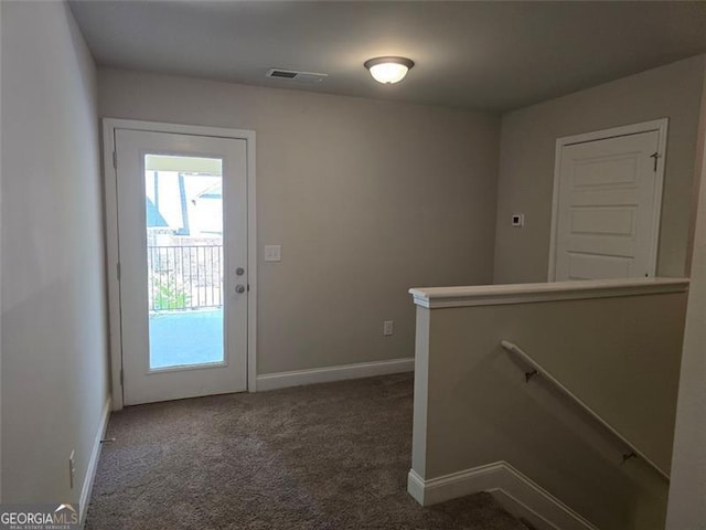 5715 Rocky Falls Dr, Suwanee, GA 30024 - carpeted foyer entrance featuring baseboards