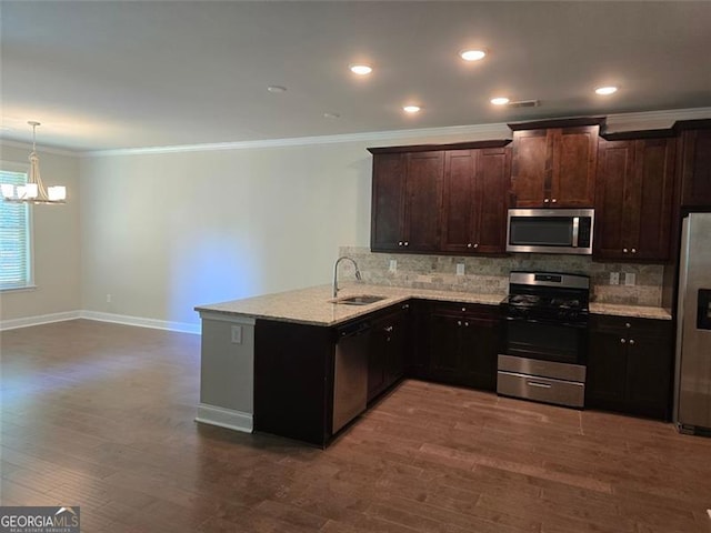 5715 Rocky Falls Dr, Suwanee, GA 30024 - kitchen featuring stainless steel appliances, a chandelier, crown molding, decorative backsplash, and dark wood-style floors