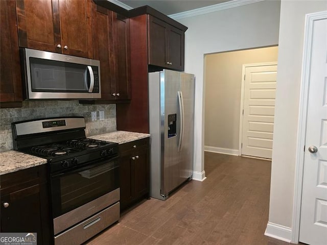 5715 Rocky Falls Dr, Suwanee, GA 30024 - kitchen with appliances with stainless steel finishes, crown molding, decorative backsplash, light stone counters, and dark brown cabinetry