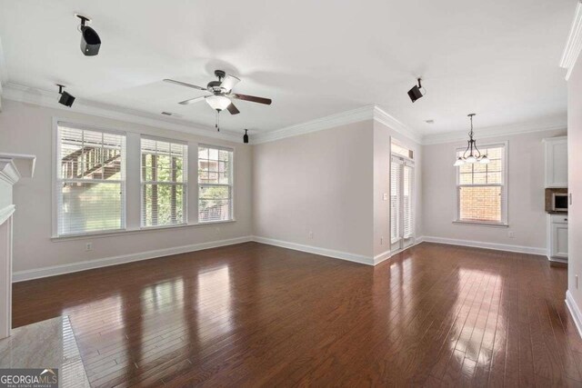 812 Autry Oak Ct, Alpharetta, GA 30022 - unfurnished living room featuring a ceiling fan, a chandelier, dark wood-style floors, ornamental molding, and a fireplace