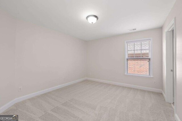 812 Autry Oak Ct, Alpharetta, GA 30022 - empty room featuring light colored carpet and baseboards
