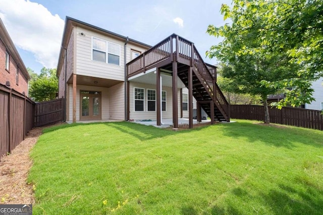 812 Autry Oak Ct, Alpharetta, GA 30022 - back of house with stairway, a fenced backyard, and a wooden deck