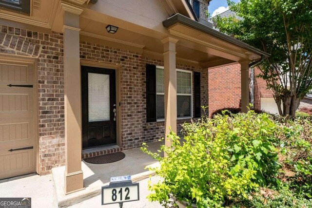 812 Autry Oak Ct, Alpharetta, GA 30022 - entrance to property featuring brick siding and a porch