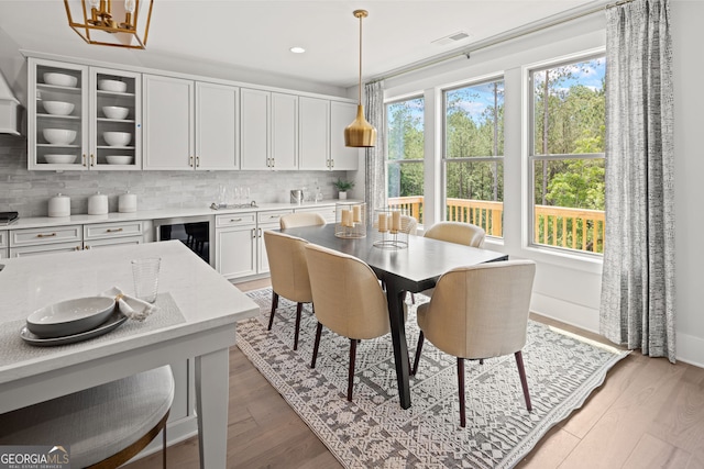608 Southland Pass, Canton, GA 30115 - dining space with beverage cooler, light wood-type flooring, and recessed lighting