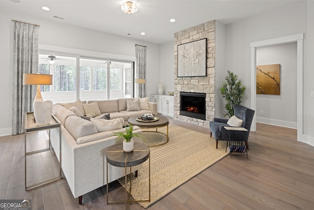 608 Southland Pass, Canton, GA 30115 - living area featuring a stone fireplace, wood finished floors, recessed lighting, and a ceiling fan