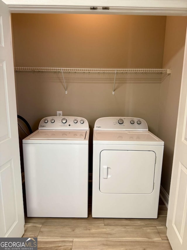460 Barnett Shoals Rd Unit 5A, Athens, GA 30605 - laundry room with independent washer and dryer and light wood-style floors