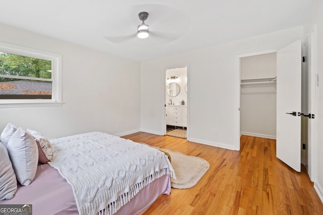 3222 Edgemont Way, Decatur, GA 30032 - bedroom featuring light wood finished floors, a closet, a spacious closet, connected bathroom, and a ceiling fan
